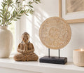 Buddha Feng Shui Set - Classic Mandala - Natural featuring a hand-carved Buddha statue in meditation pose with a detailed mandala sculpture on a stand, styled with a candle and vase.