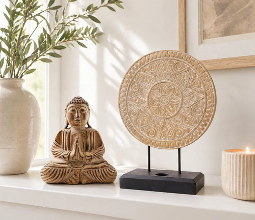 Buddha Feng Shui Set - Classic Mandala - Natural featuring a hand-carved Buddha statue and a mandala design on a black stand displayed on a white surface with natural decor.