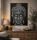 Buddha Painting - Grey Brocade Detail featuring a serene Buddha face in textured grey tones displayed above a rustic wooden sideboard with warm ambient lighting and natural decor.