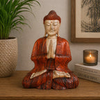 Hand Carved Buddha Statue - 30cm Welcome seated in meditation with hands in prayer gesture, crafted in warm wood tones, placed on a wooden surface with cozy home decor.