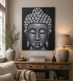 Buddha Painting - Grey Sand Finish hanging above a rustic wooden console table with decorative vases, a lit candle, reed diffuser, and a lamp in a cozy living room setting.