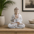Buddha Statue Whitewash - 30cm Teaching Transmission in a peaceful home setting on a wooden surface beside neutral decor, showcasing serene meditation and hand-carved detail.