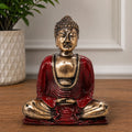 Red & Gold Buddha - Medium hand carved statue in a meditative pose with detailed gold and deep red finish, perfect for serene Buddha decor on tabletops or shelves.