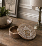 Big Round Box 17.5x7.5cm - Buddha Face Whitewash wooden round storage box with intricately carved Buddha face design on the lid, placed on a rustic wooden surface.