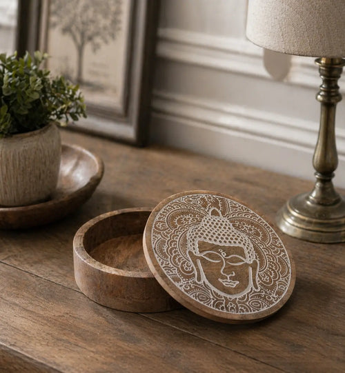 Big Round Box 17.5x7.5cm - Buddha Face Whitewash wooden round storage box with intricately carved Buddha face design on the lid, placed on a rustic wooden surface.