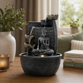 Tabletop Water Feature - 19x19x28cm - Buddha, Lotus Flower Cascading Potsx with a serene Buddha statue and lotus flower design, creating a peaceful ambiance for home decor.