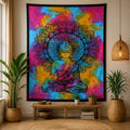 Double Cotton Bedspread + Wall Hanging - Peaceful Buddha features a vibrant tie-dye background with a detailed black Buddha figure and intricate mandala design, displayed in a cozy natural room setting.